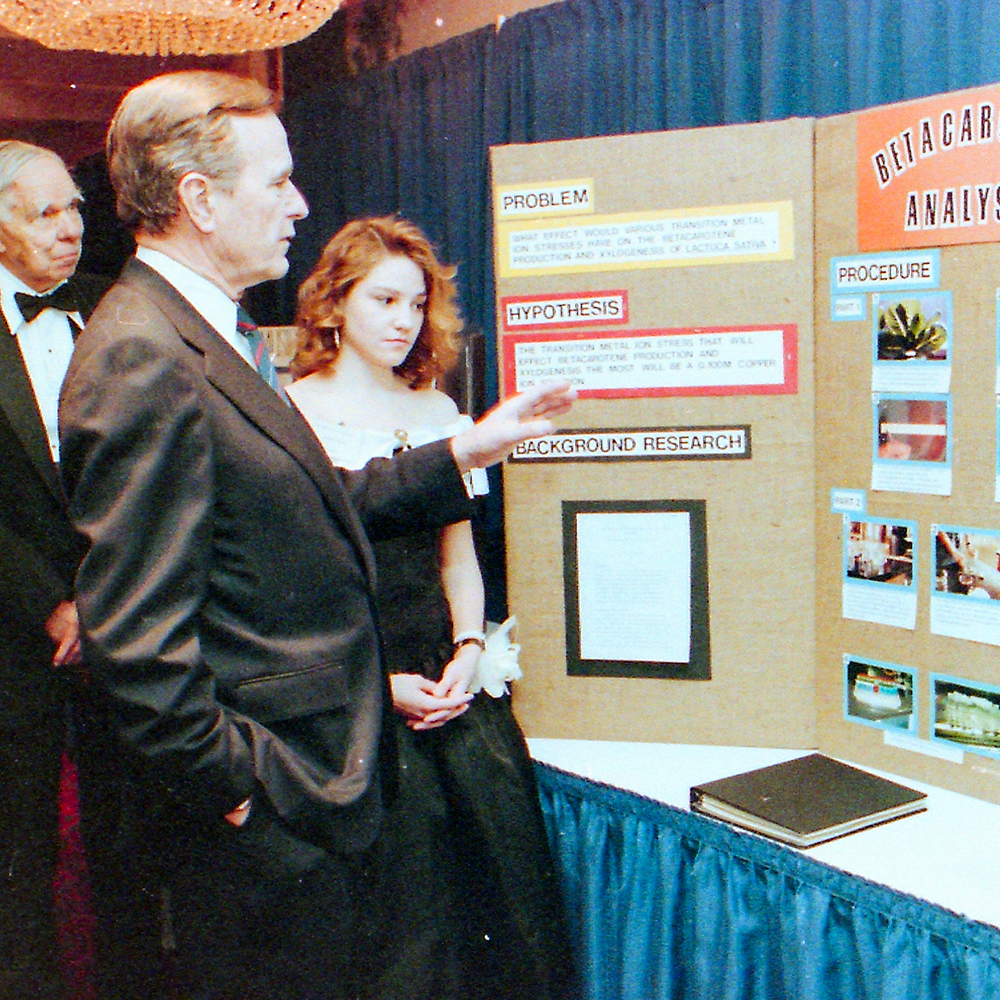 STS finalist Susan Criss discusses her research with President George H. W. Bush