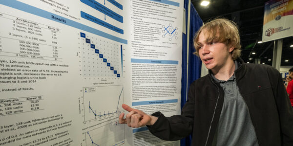 2023 STS Finalist Joshua Shunk with his project at the 2022 ISEF in Atlanta